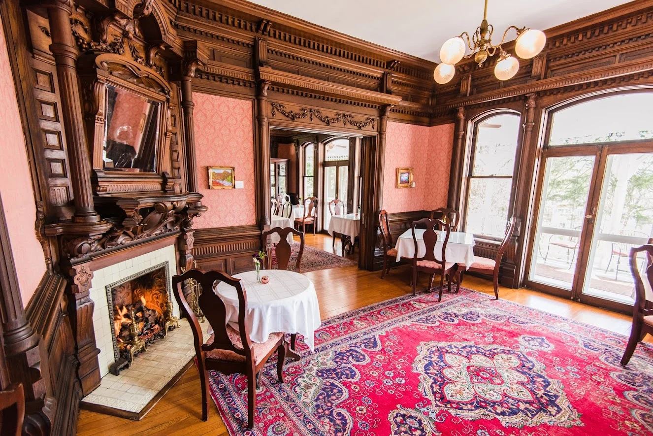 The dining room at Cedar Crest Inn with its original fireplace