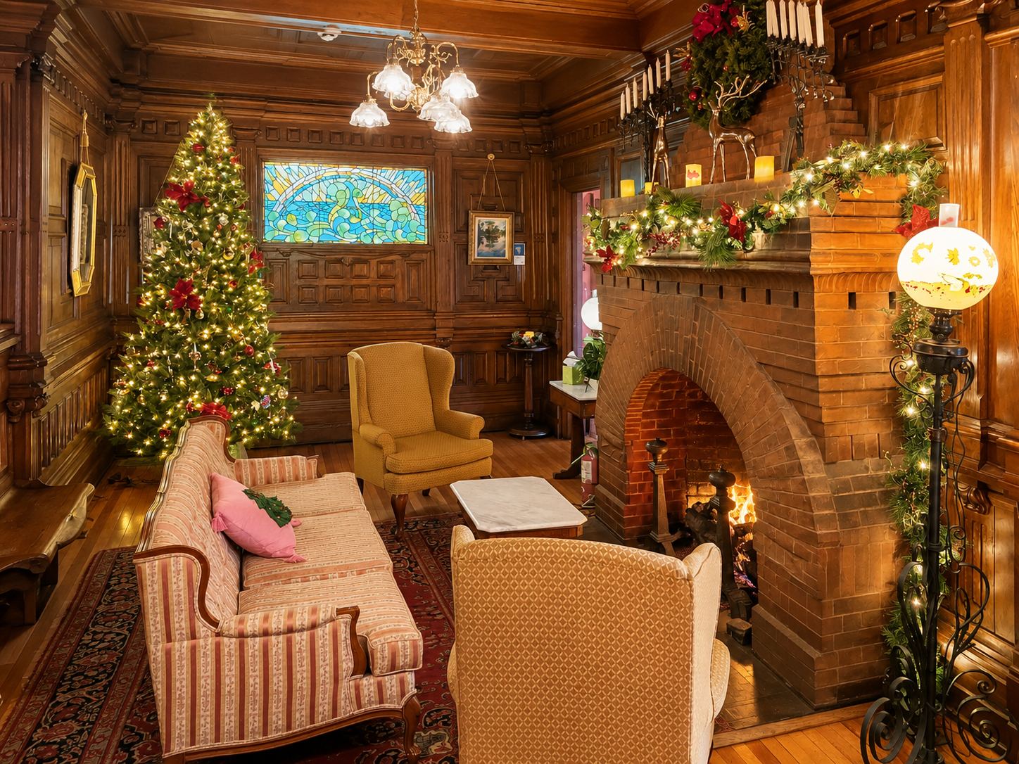 The parlor at Cedar Crest Inn decorated for Christmas by the fireplace