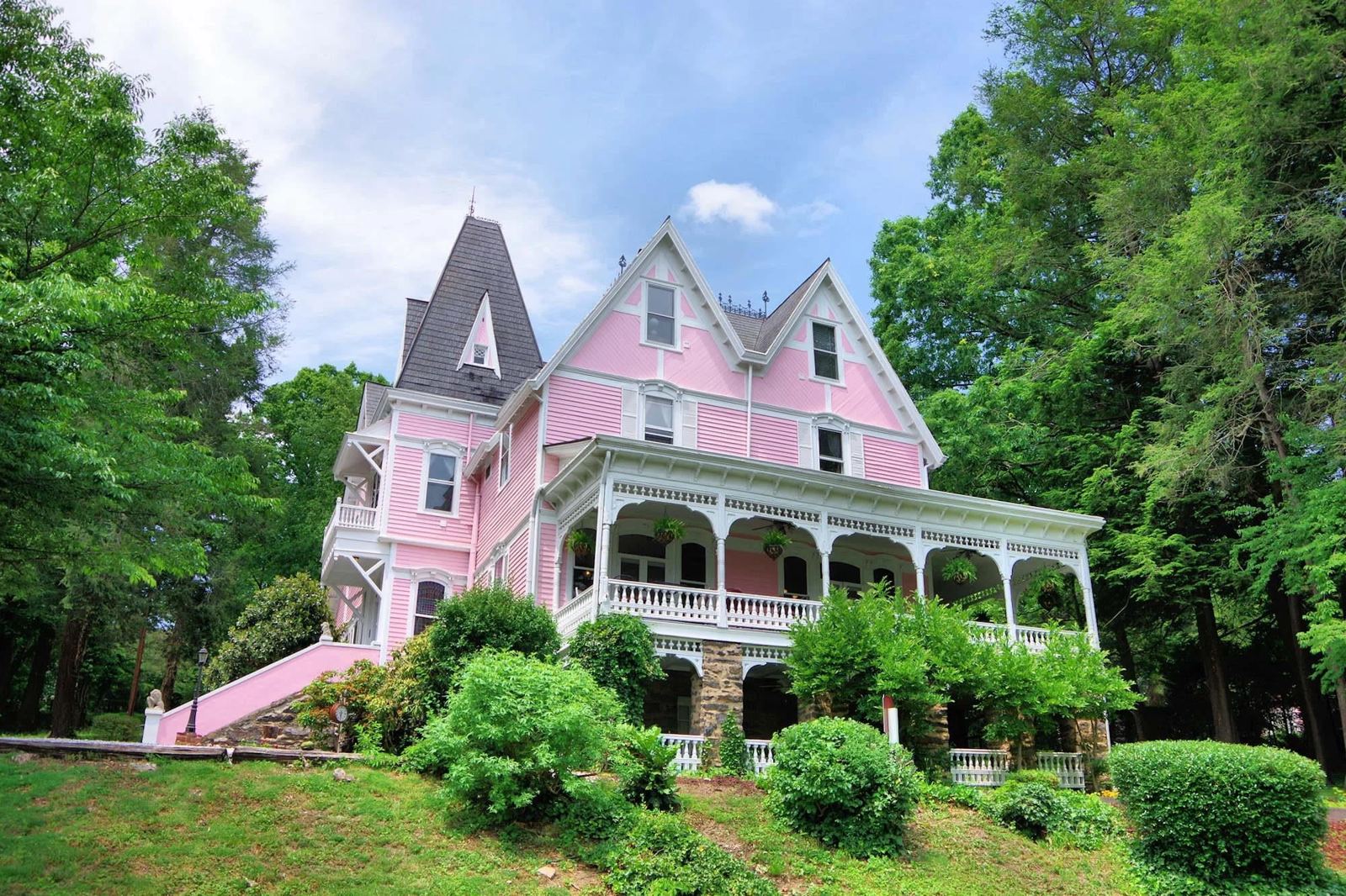 Cedar Crest Inn, the pink 1891 Queen Anne Victorian mansion on a hill in Asheville, North Carolina